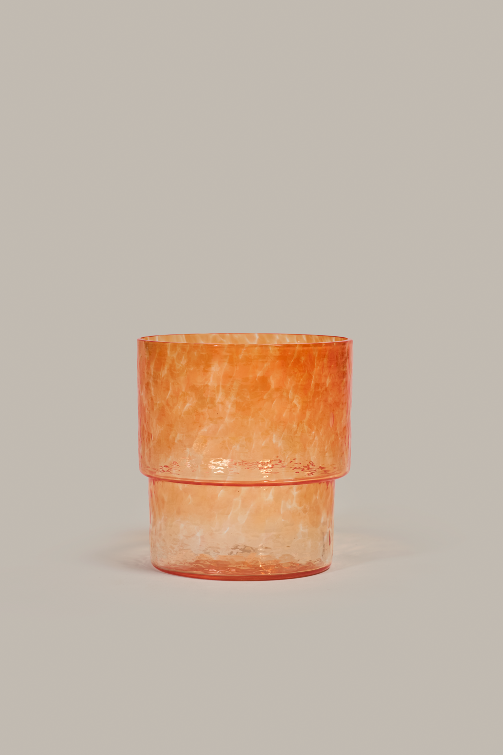Stackable Pool glass in warm orange colored glass by Cornelius Réer
