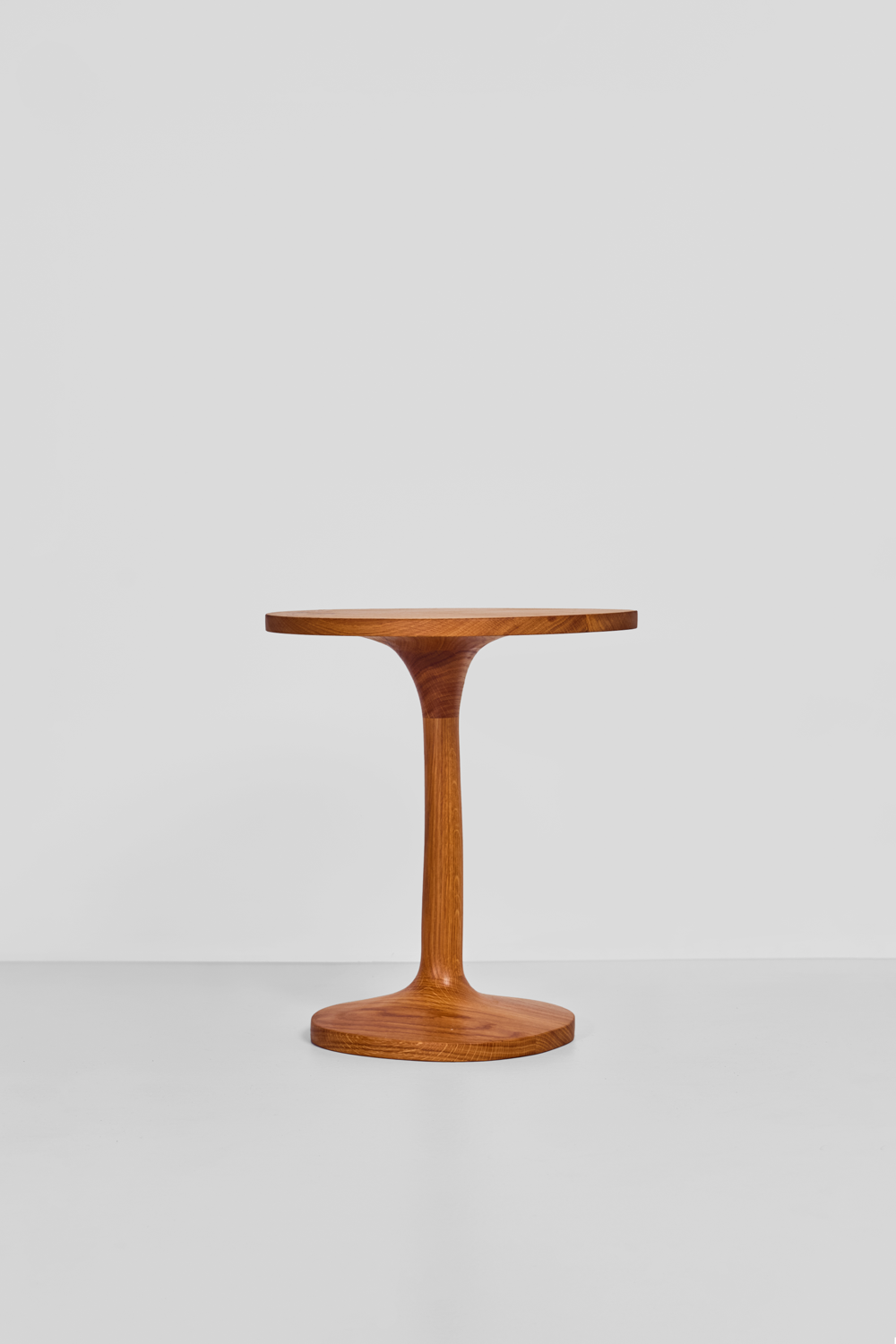 Detail of continuous hand-lathed solid oak column and flared pedestal base